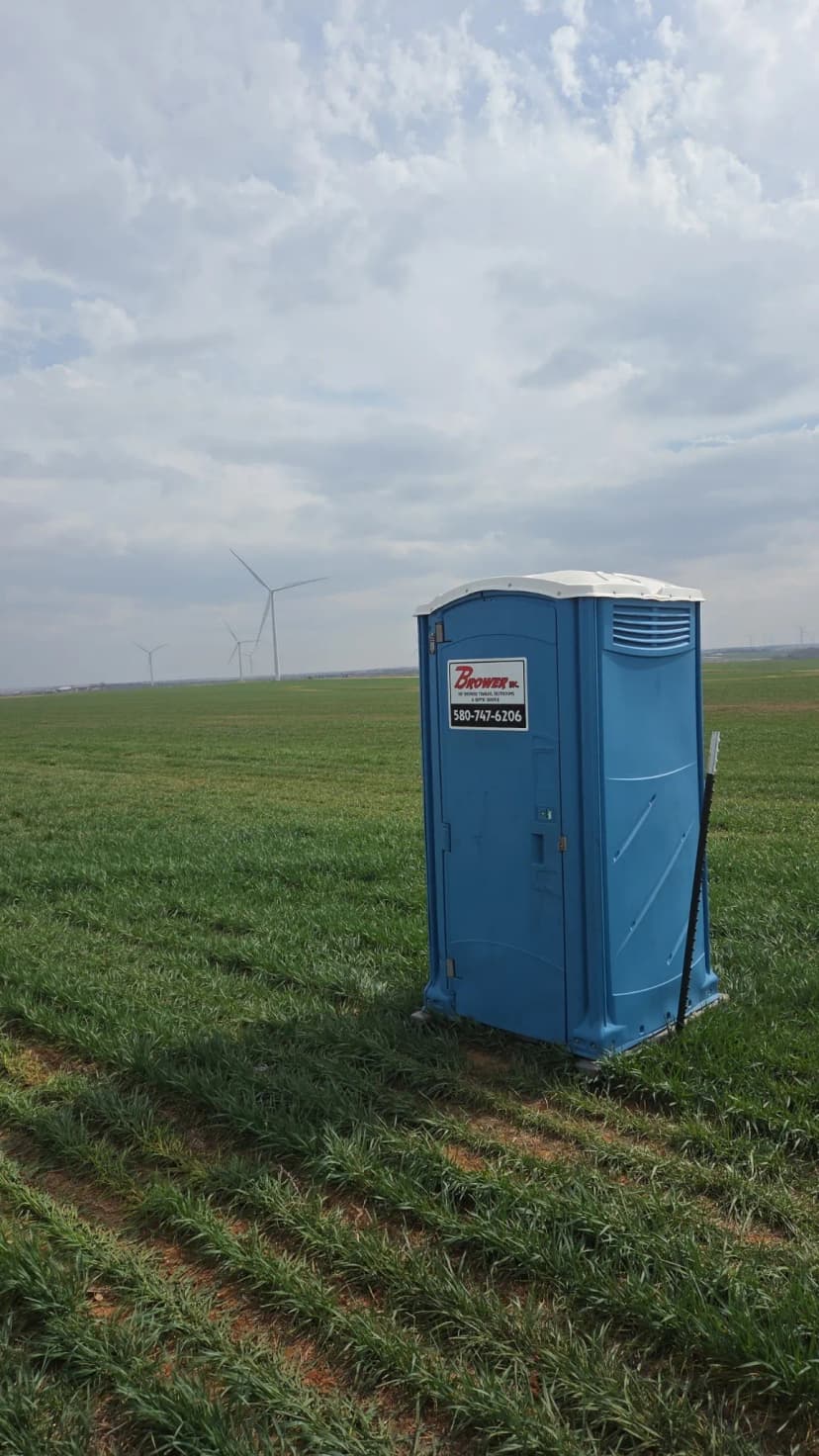 Brower Inc. portable restroom deployed at a wind farm field site in rural Oklahoma
